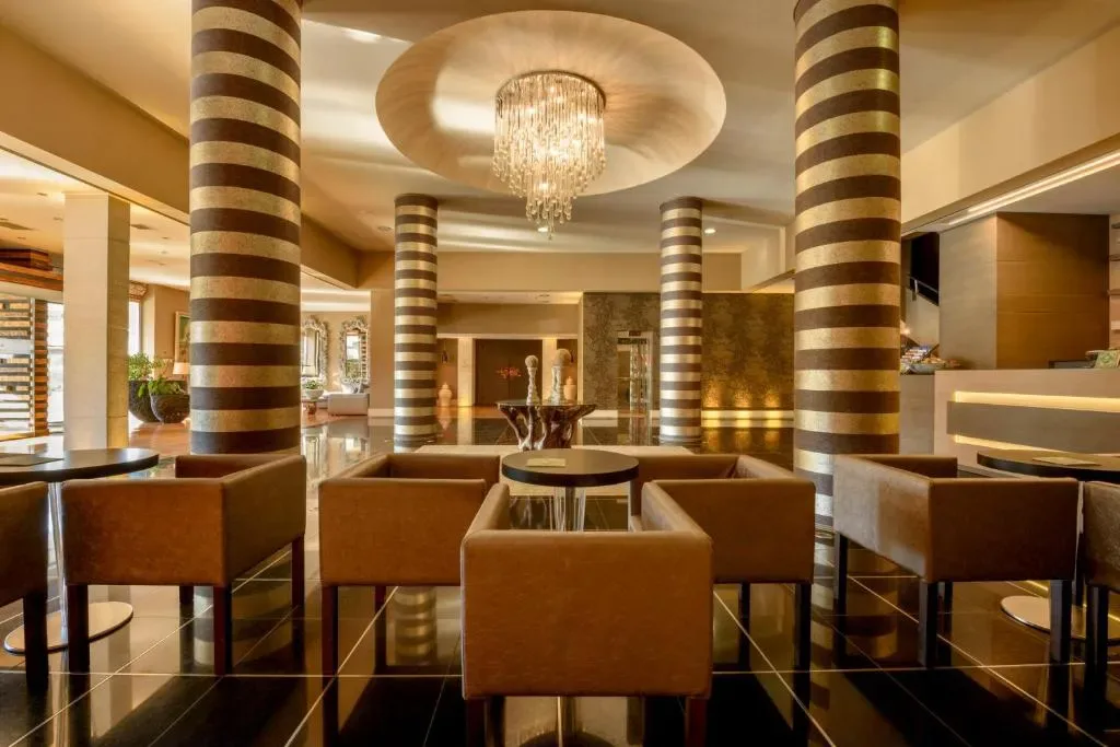 Congo Palace Hotel pool area and beachfront in Glyfada