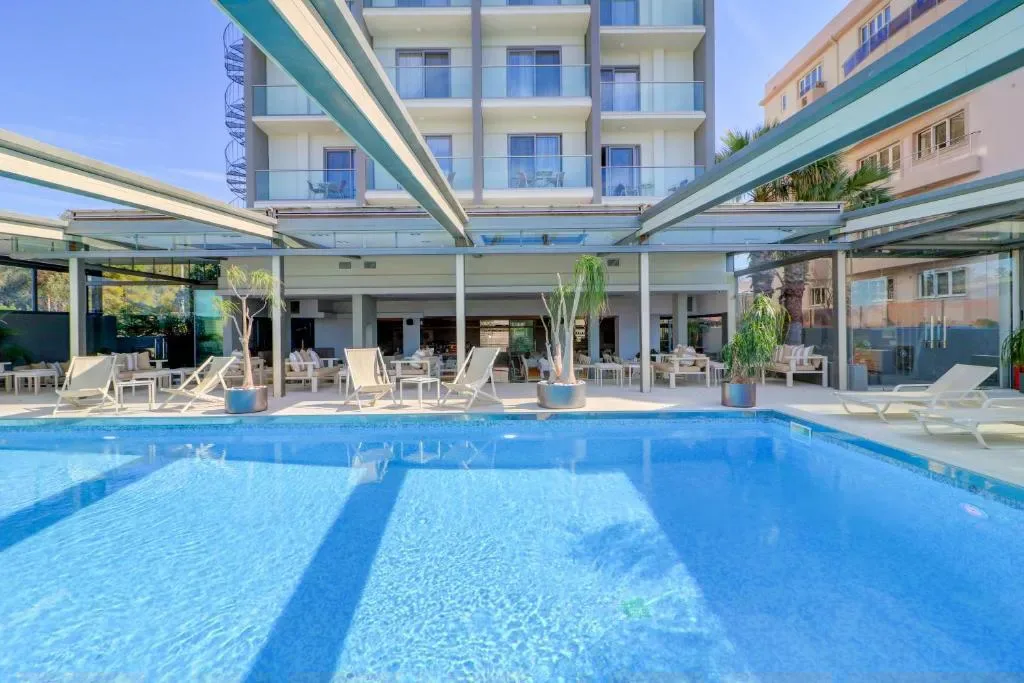 Palace Hotel Glyfada pool and garden with sea views