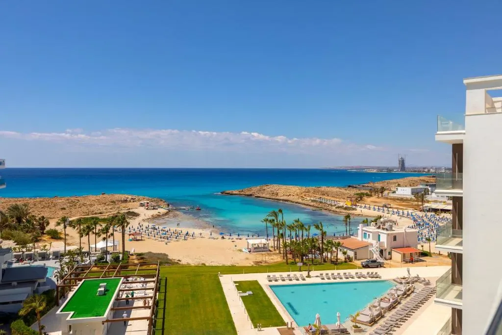 Chrysomare Beach Hotel & Resort aerial view with beach and pools, Ayia Napa