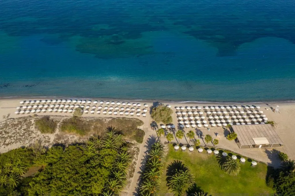 Swimming pool and beach at Caravia Beach Hotel, Marmari Kos