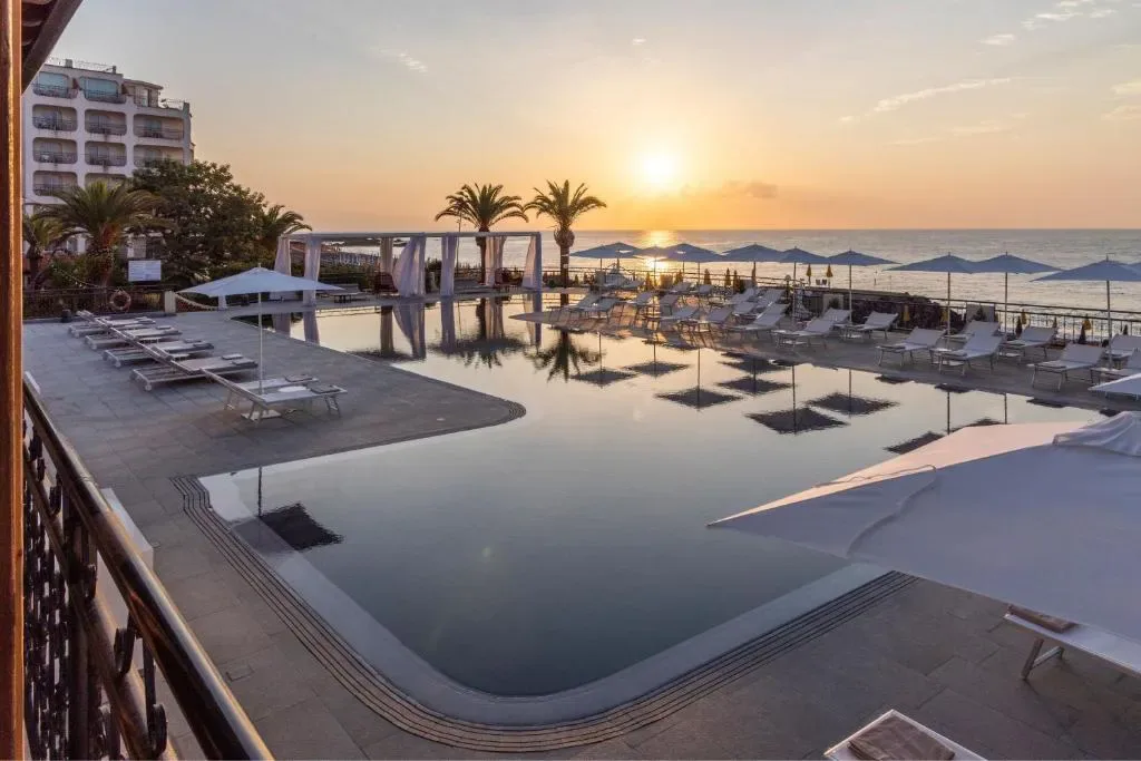 Delta Hotels Giardini Naxos exterior and infinity pool overlooking the sea